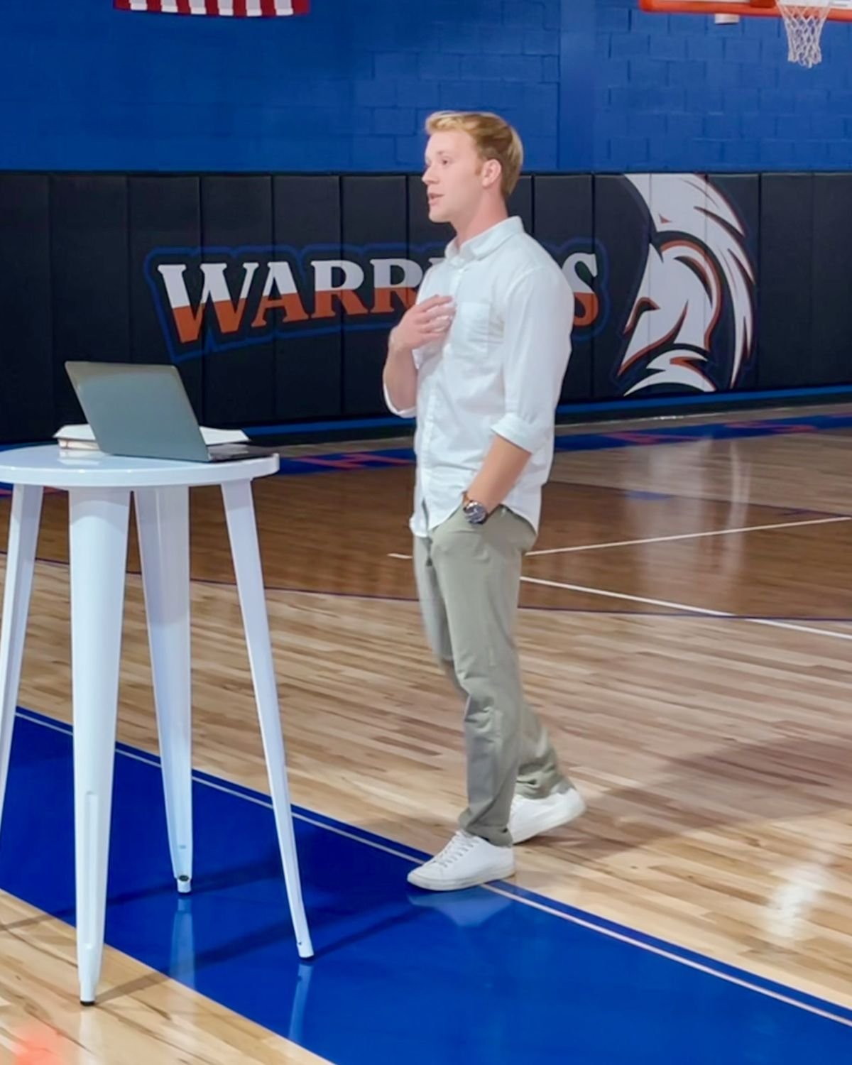 Hayden Pugh speaking to students in a school gym